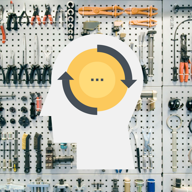 Shows a pegboard wall full of well organized tools. In front of it is a profile of a man with arrows pointing around a circle indicating his way of thinking is being transformed... ie. cultural transformation